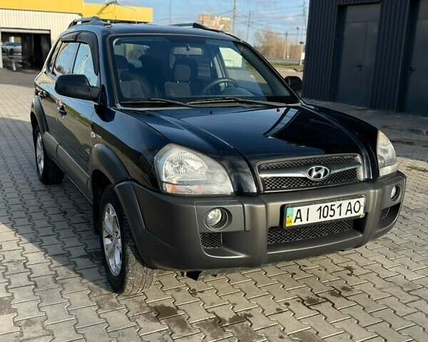 Черный Хендай Туксон, объемом двигателя 1.98 л и пробегом 220 тыс. км за 7500 $, фото 1 на Automoto.ua
