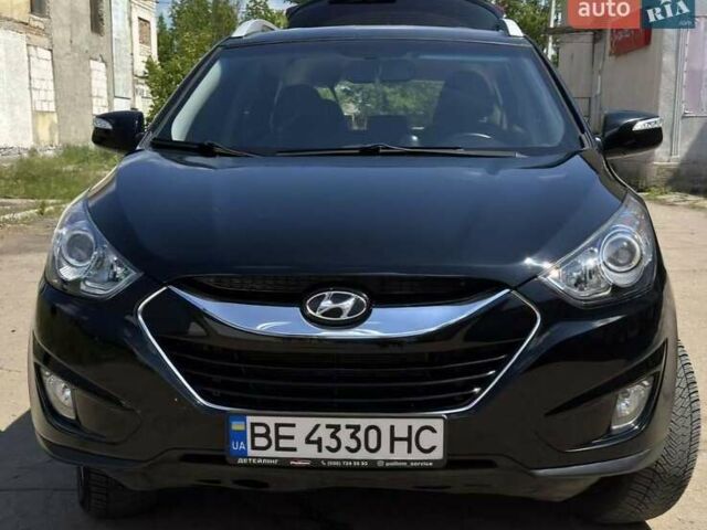 Черный Хендай Туксон, объемом двигателя 2 л и пробегом 242 тыс. км за 13300 $, фото 1 на Automoto.ua