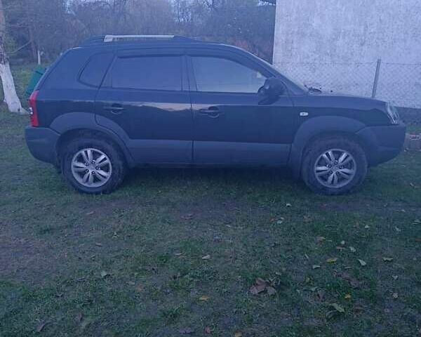 Черный Хендай Туксон, объемом двигателя 1.98 л и пробегом 298 тыс. км за 9300 $, фото 1 на Automoto.ua