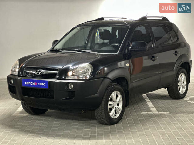 Черный Хендай Туксон, объемом двигателя 1.98 л и пробегом 129 тыс. км за 10600 $, фото 1 на Automoto.ua