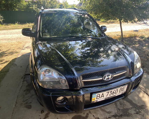 Черный Хендай Туксон, объемом двигателя 1.98 л и пробегом 245 тыс. км за 9000 $, фото 1 на Automoto.ua