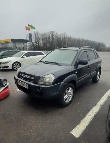 Черный Хендай Туксон, объемом двигателя 1.98 л и пробегом 282 тыс. км за 8000 $, фото 1 на Automoto.ua