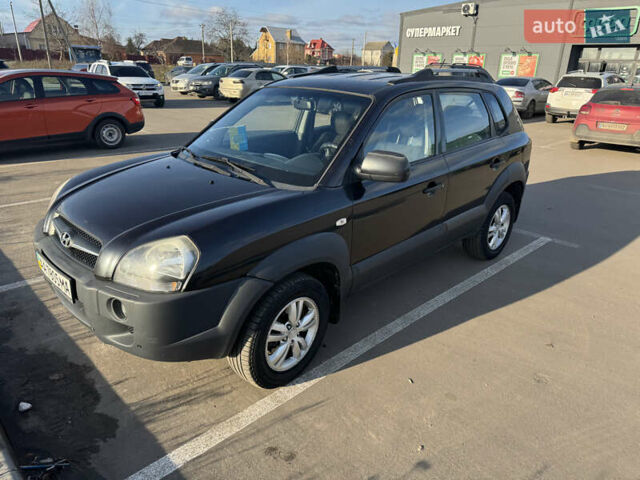 Черный Хендай Туксон, объемом двигателя 1.98 л и пробегом 218 тыс. км за 9350 $, фото 1 на Automoto.ua