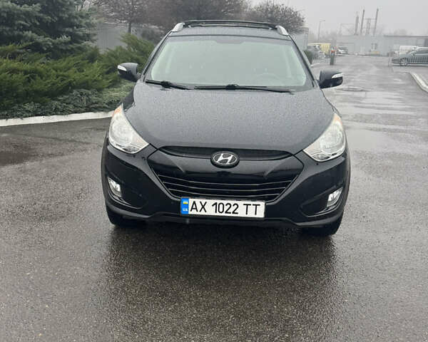 Черный Хендай Туксон, объемом двигателя 2.4 л и пробегом 143 тыс. км за 12000 $, фото 1 на Automoto.ua