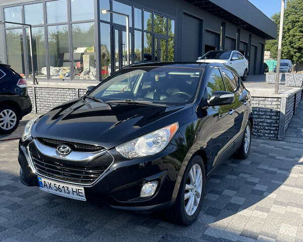 Черный Хендай Туксон, объемом двигателя 2.49 л и пробегом 165 тыс. км за 13500 $, фото 1 на Automoto.ua