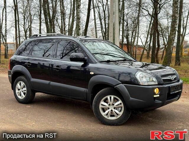 Черный Хендай Туксон, объемом двигателя 2 л и пробегом 125 тыс. км за 9850 $, фото 1 на Automoto.ua