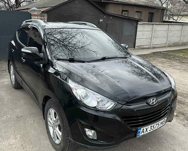 Черный Хендай Туксон, объемом двигателя 2.4 л и пробегом 132 тыс. км за 12900 $, фото 1 на Automoto.ua