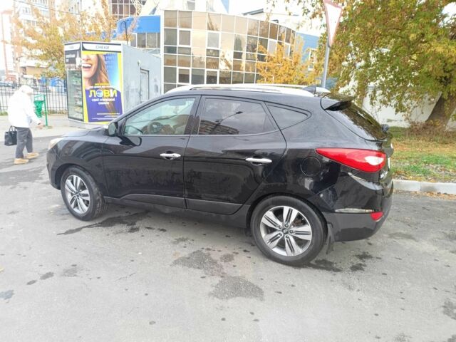 Черный Хендай Туксон, объемом двигателя 2.4 л и пробегом 128 тыс. км за 13000 $, фото 1 на Automoto.ua