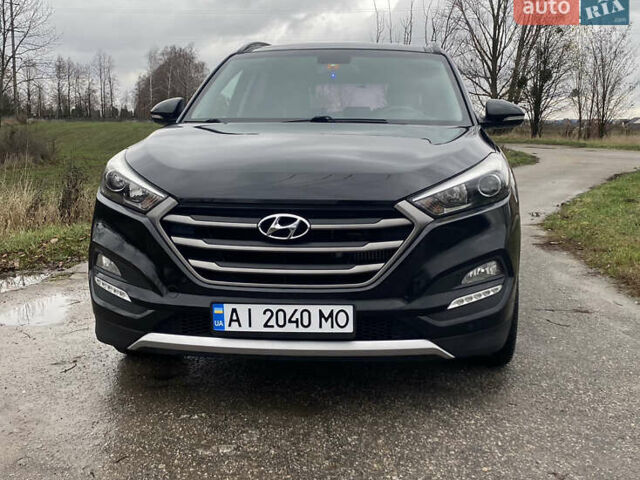 Черный Хендай Туксон, объемом двигателя 2 л и пробегом 190 тыс. км за 18000 $, фото 1 на Automoto.ua