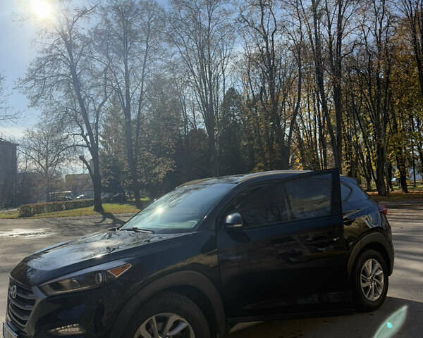 Черный Хендай Туксон, объемом двигателя 2 л и пробегом 100 тыс. км за 16300 $, фото 1 на Automoto.ua