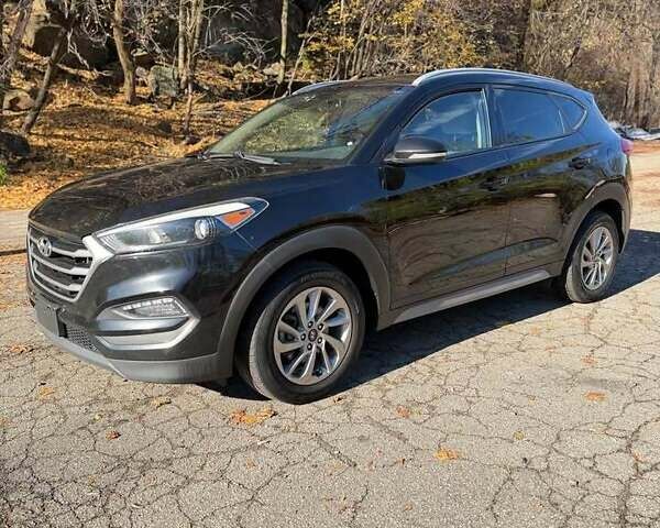 Чорний Хендай Туксон, об'ємом двигуна 2 л та пробігом 92 тис. км за 19000 $, фото 1 на Automoto.ua