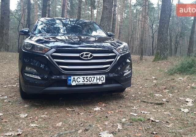 Черный Хендай Туксон, объемом двигателя 2 л и пробегом 100 тыс. км за 17200 $, фото 1 на Automoto.ua