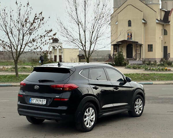 Черный Хендай Туксон, объемом двигателя 2 л и пробегом 70 тыс. км за 23000 $, фото 1 на Automoto.ua