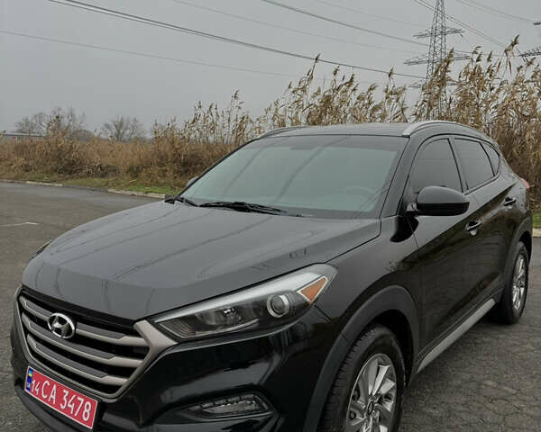 Чорний Хендай Туксон, об'ємом двигуна 2 л та пробігом 107 тис. км за 15500 $, фото 1 на Automoto.ua