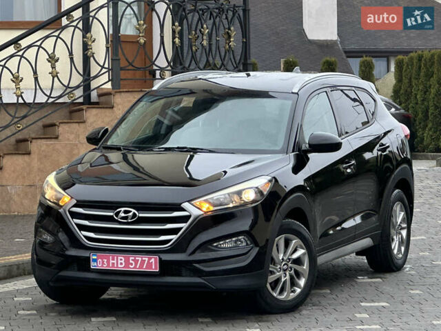 Черный Хендай Туксон, объемом двигателя 2 л и пробегом 156 тыс. км за 12800 $, фото 1 на Automoto.ua