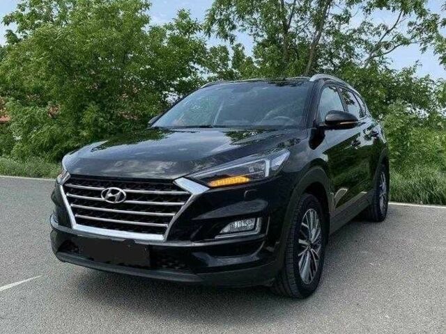 Черный Хендай Туксон, объемом двигателя 2 л и пробегом 129 тыс. км за 16500 $, фото 1 на Automoto.ua