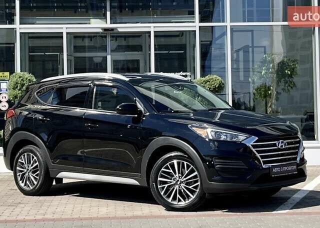 Черный Хендай Туксон, объемом двигателя 2.36 л и пробегом 53 тыс. км за 19500 $, фото 1 на Automoto.ua