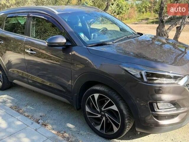 Коричневый Хендай Туксон, объемом двигателя 2 л и пробегом 98 тыс. км за 22000 $, фото 1 на Automoto.ua