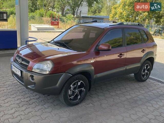 Червоний Хендай Туксон, об'ємом двигуна 1.99 л та пробігом 246 тис. км за 8200 $, фото 1 на Automoto.ua