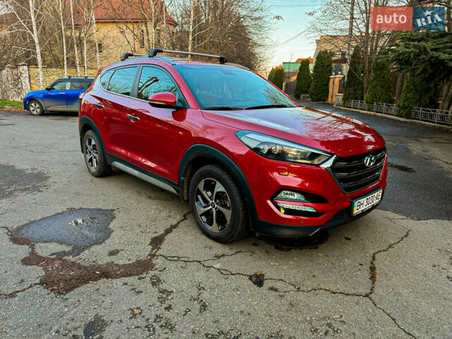 Красный Хендай Туксон, объемом двигателя 2 л и пробегом 87 тыс. км за 21500 $, фото 1 на Automoto.ua