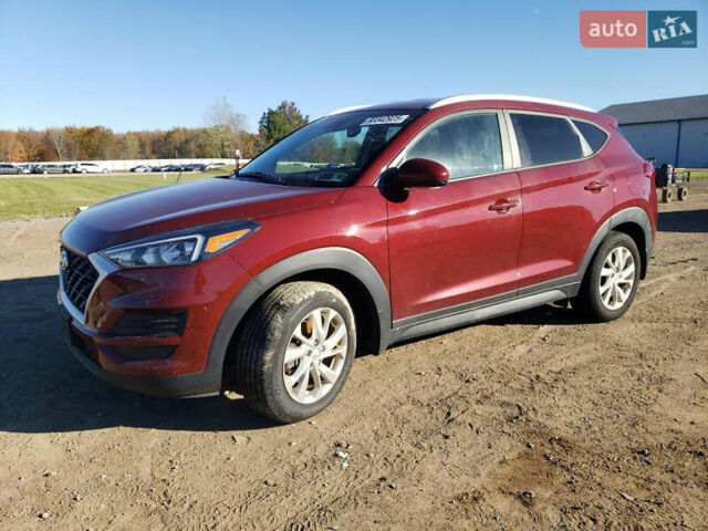 Красный Хендай Туксон, объемом двигателя 2 л и пробегом 71 тыс. км за 13300 $, фото 1 на Automoto.ua