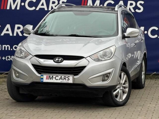 Серый Хендай Туксон, объемом двигателя 2.4 л и пробегом 196 тыс. км за 12900 $, фото 1 на Automoto.ua