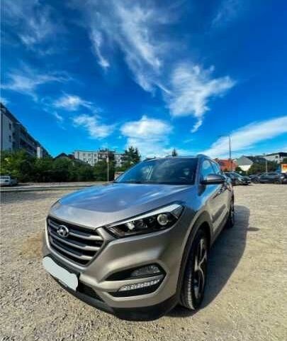 Серый Хендай Туксон, объемом двигателя 2.4 л и пробегом 94 тыс. км за 10700 $, фото 1 на Automoto.ua