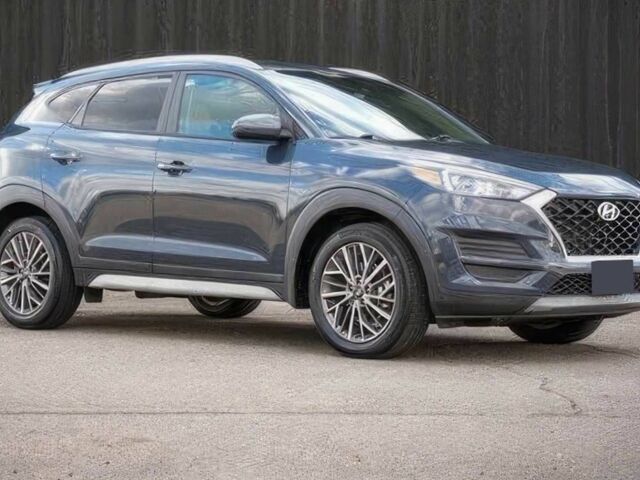 Серый Хендай Туксон, объемом двигателя 2.4 л и пробегом 33 тыс. км за 14000 $, фото 1 на Automoto.ua