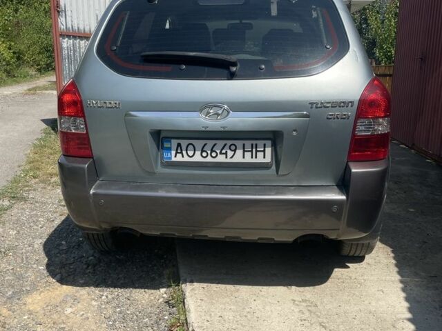 Серый Хендай Туксон, объемом двигателя 2 л и пробегом 250 тыс. км за 5800 $, фото 1 на Automoto.ua