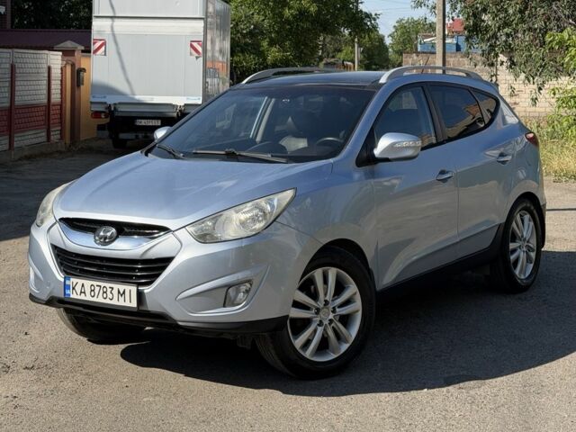 Синий Хендай Туксон, объемом двигателя 2.4 л и пробегом 231 тыс. км за 9902 $, фото 1 на Automoto.ua