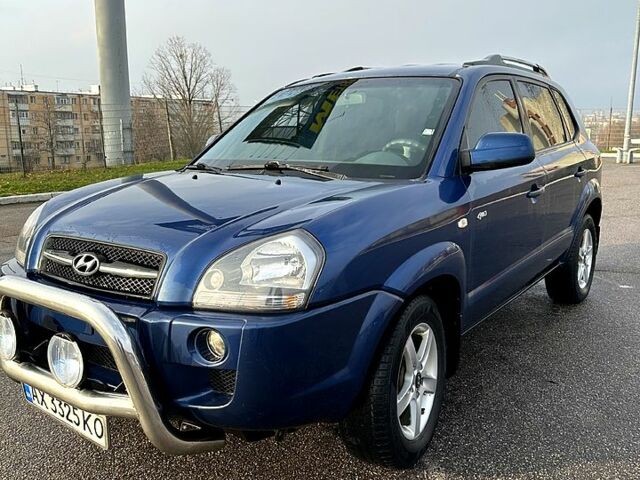 Синий Хендай Туксон, объемом двигателя 2 л и пробегом 224 тыс. км за 8300 $, фото 1 на Automoto.ua