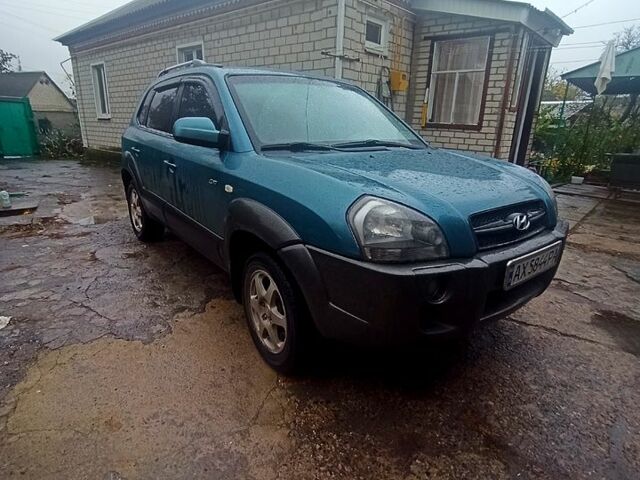 Синий Хендай Туксон, объемом двигателя 2 л и пробегом 210 тыс. км за 7550 $, фото 1 на Automoto.ua