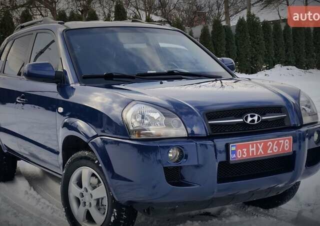 Синий Хендай Туксон, объемом двигателя 2 л и пробегом 204 тыс. км за 8500 $, фото 1 на Automoto.ua
