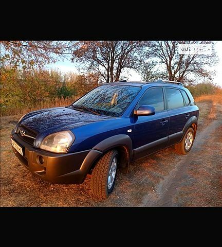 Синий Хендай Туксон, объемом двигателя 2 л и пробегом 220 тыс. км за 8500 $, фото 1 на Automoto.ua