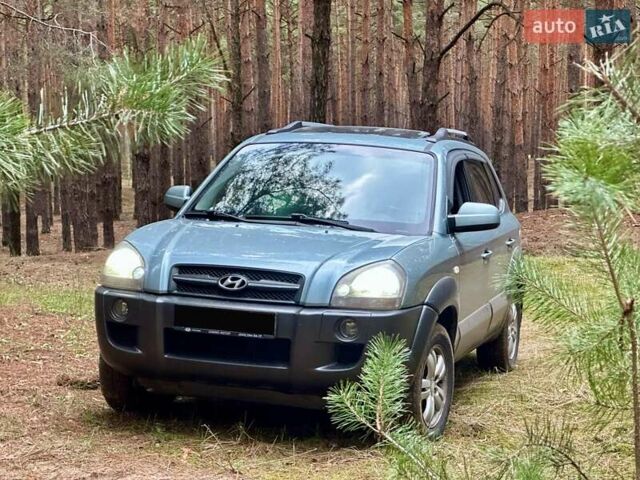 Синий Хендай Туксон, объемом двигателя 1.98 л и пробегом 233 тыс. км за 8650 $, фото 1 на Automoto.ua