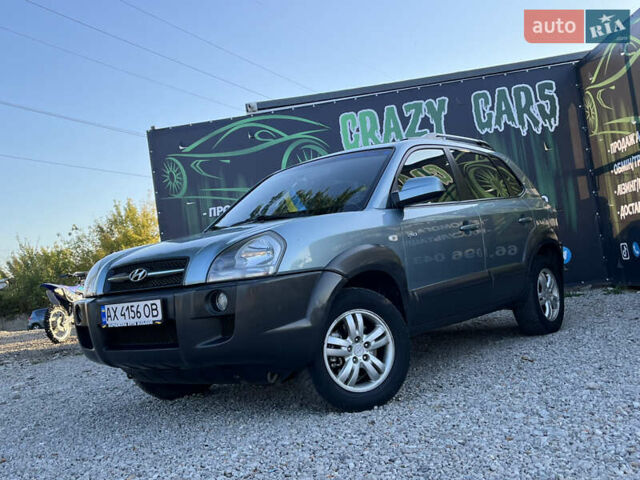Синий Хендай Туксон, объемом двигателя 2 л и пробегом 317 тыс. км за 9600 $, фото 1 на Automoto.ua