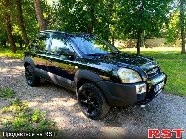 Зеленый Хендай Туксон, объемом двигателя 2 л и пробегом 210 тыс. км за 7699 $, фото 1 на Automoto.ua