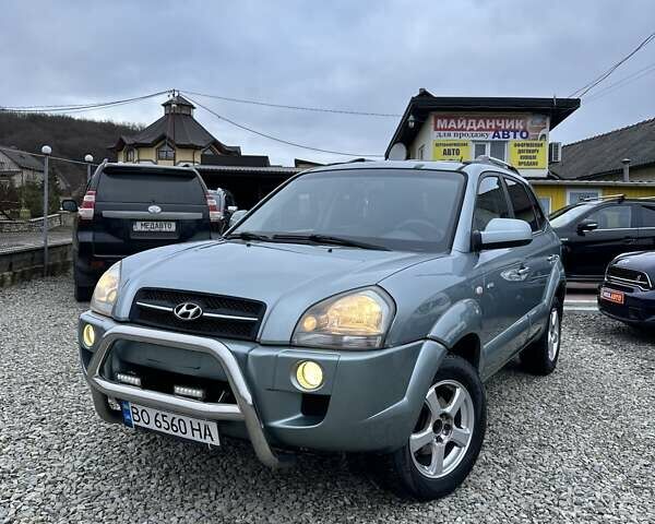 Зеленый Хендай Туксон, объемом двигателя 2 л и пробегом 190 тыс. км за 8450 $, фото 1 на Automoto.ua