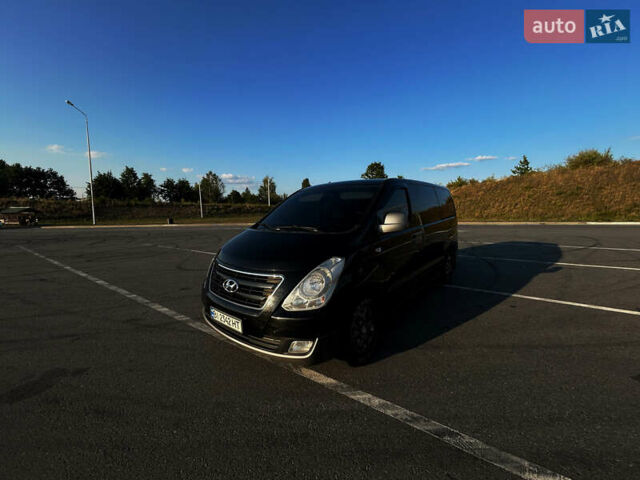 Черный Хендай H-1, объемом двигателя 2.5 л и пробегом 288 тыс. км за 16000 $, фото 1 на Automoto.ua