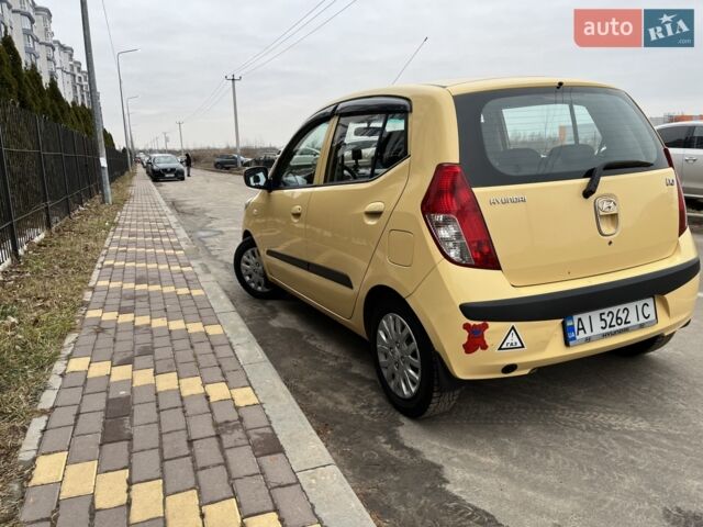 Желтый Хендай и10, объемом двигателя 1.1 л и пробегом 175 тыс. км за 5900 $, фото 1 на Automoto.ua