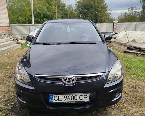 Черный Хендай i30, объемом двигателя 1.4 л и пробегом 215 тыс. км за 5500 $, фото 1 на Automoto.ua