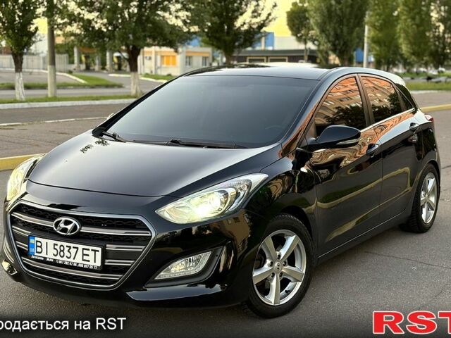 Чорний Хендай i30, об'ємом двигуна 1.6 л та пробігом 160 тис. км за 8699 $, фото 1 на Automoto.ua