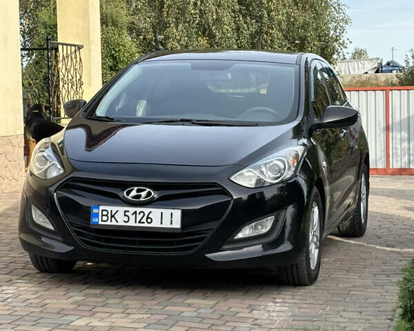 Черный Хендай i30, объемом двигателя 1.4 л и пробегом 259 тыс. км за 6600 $, фото 1 на Automoto.ua