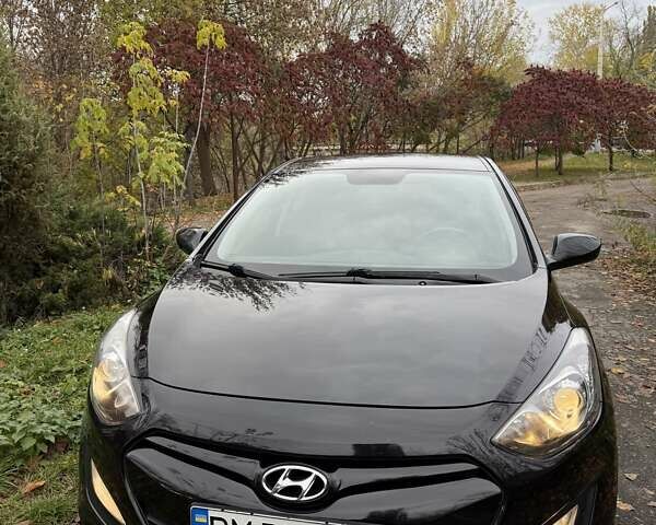Черный Хендай i30, объемом двигателя 1.58 л и пробегом 110 тыс. км за 8500 $, фото 1 на Automoto.ua