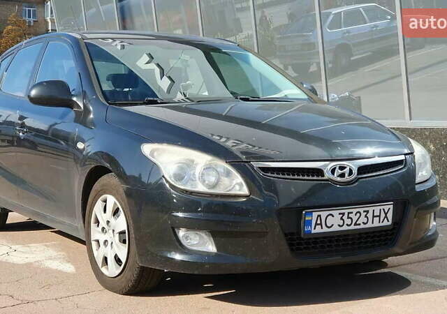 Черный Хендай i30, объемом двигателя 1.6 л и пробегом 228 тыс. км за 5200 $, фото 1 на Automoto.ua