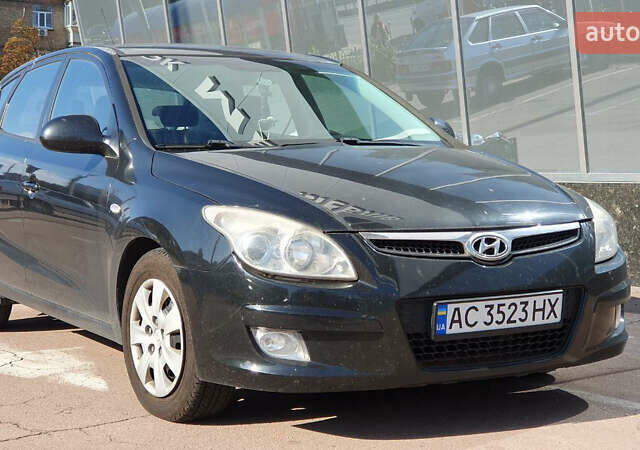 Черный Хендай i30, объемом двигателя 1.6 л и пробегом 228 тыс. км за 6200 $, фото 1 на Automoto.ua