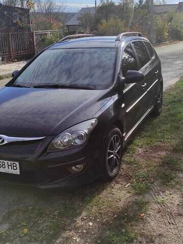 Черный Хендай i30, объемом двигателя 1.6 л и пробегом 241 тыс. км за 6400 $, фото 1 на Automoto.ua