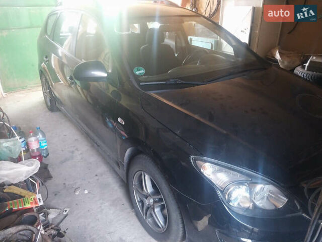 Черный Хендай i30, объемом двигателя 1.58 л и пробегом 122 тыс. км за 7000 $, фото 1 на Automoto.ua