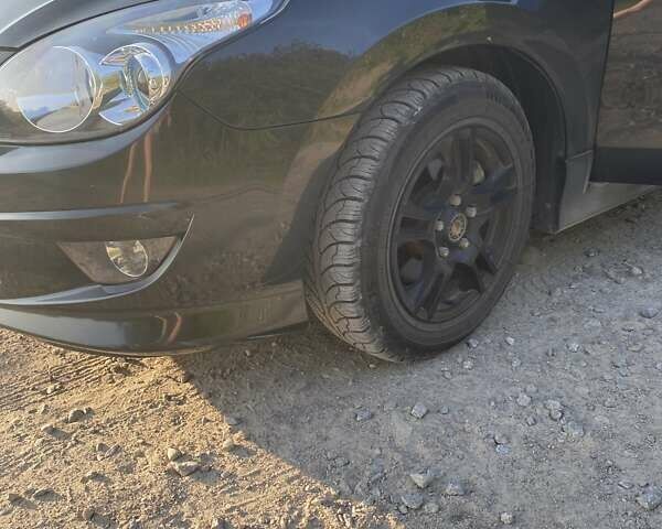 Чорний Хендай i30, об'ємом двигуна 1.4 л та пробігом 144 тис. км за 5700 $, фото 1 на Automoto.ua
