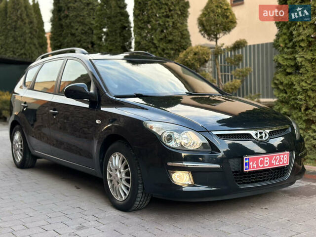Черный Хендай i30, объемом двигателя 1.4 л и пробегом 245 тыс. км за 4999 $, фото 1 на Automoto.ua